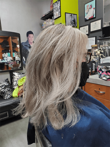 A customer with a blonde haircut