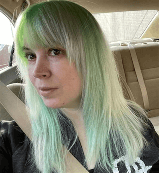 A customer with a green ombre haircut