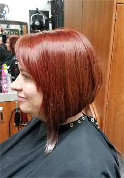 A customer with a red asymmetrical haircut