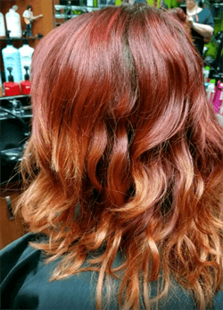 A customer with a red ombre haircut