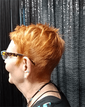 A customer with a short red haircut