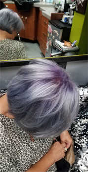 A customer with a white and purple haircut